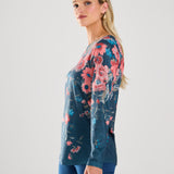 This FDJ long sleeve boat neck top features a beautiful floral print that adds a touch of elegance to any outfit. The design is denim-friendly, making it versatile and perfect for any casual occasion. Elevate your style with this top's eye-catching pattern and comfortable fit.