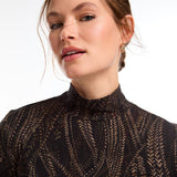 This FDJ Long Sleeve Mock Neck Top features a subtle trellis print in neutral colours. The sophisticated design adds a touch of elegance to your wardrobe, making it a versatile and stylish addition. The perfect balance between bold and understated, this top is sure to become a staple in your closet.