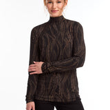 This FDJ Long Sleeve Mock Neck Top features a subtle trellis print in neutral colours. The sophisticated design adds a touch of elegance to your wardrobe, making it a versatile and stylish addition. The perfect balance between bold and understated, this top is sure to become a staple in your closet.