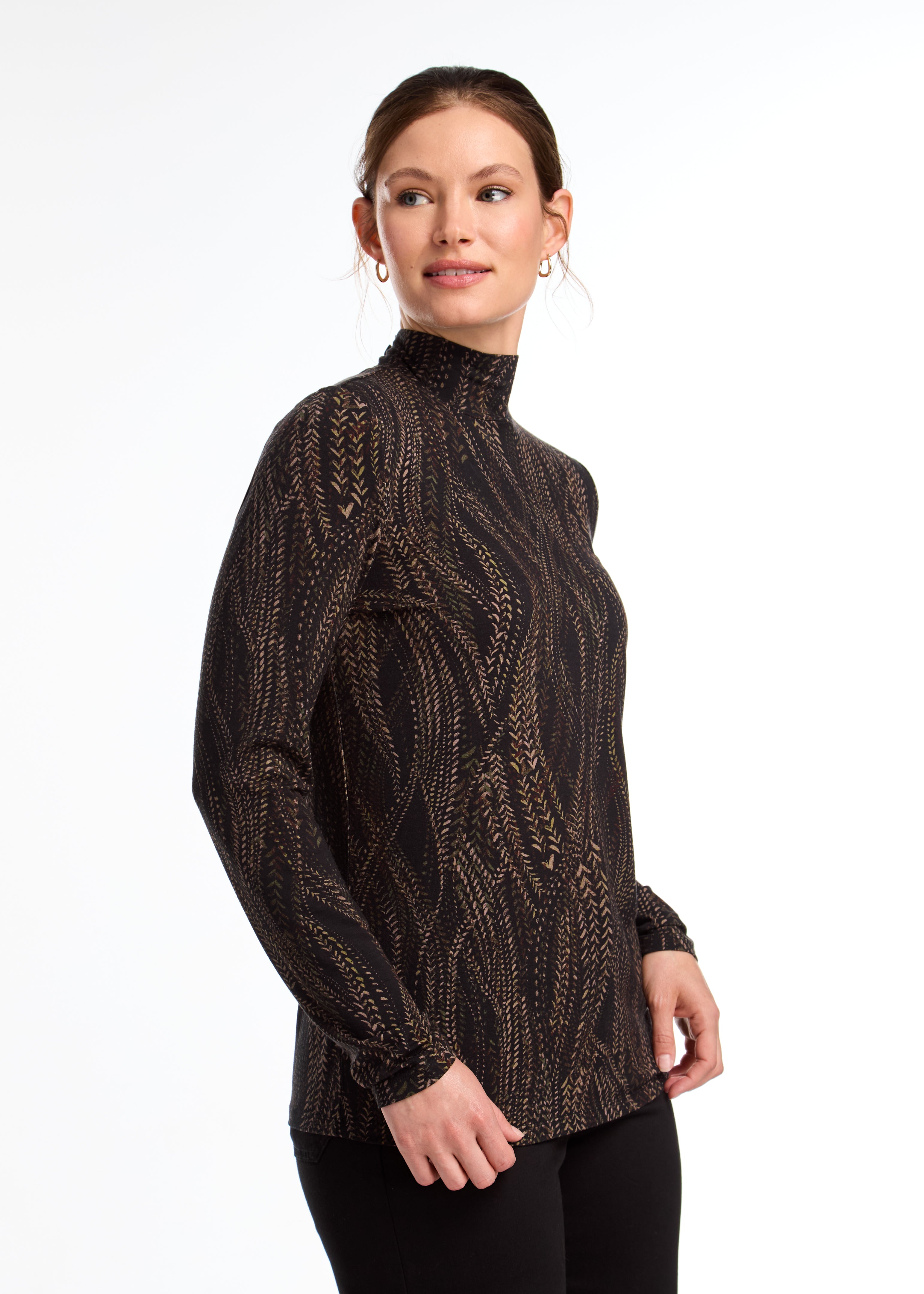 This FDJ Long Sleeve Mock Neck Top features a subtle trellis print in neutral colours. The sophisticated design adds a touch of elegance to your wardrobe, making it a versatile and stylish addition. The perfect balance between bold and understated, this top is sure to become a staple in your closet.