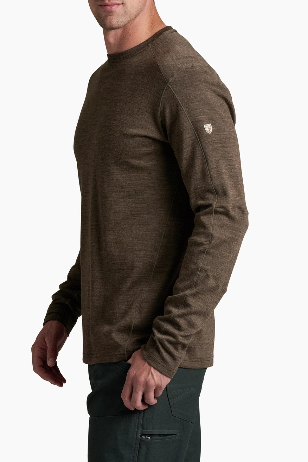 Man wearing a brown long-sleeve shirt on a white background