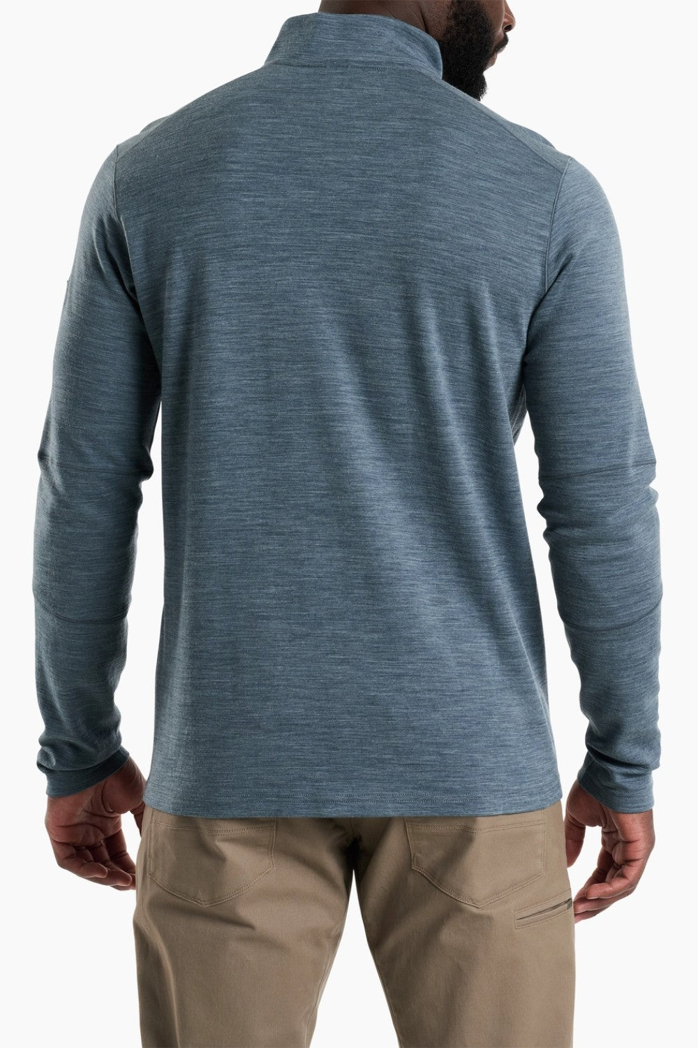 Blue long-sleeve shirt worn by a person on a white background