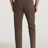 Brown pants worn by a person on a white background