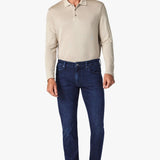 This pair of denim is perfect for the man seeking a distinguished look without compromising on comfort. These are cut from smooth, premium denim that features superior stretch and shape retention in a versatile wash that’s effortless to wear while enhancing the streamlined silhouette. A contemporary fit that’s endlessly flattering, these have a mid rise and tailored straight leg that features subtle tapering from the knee down.