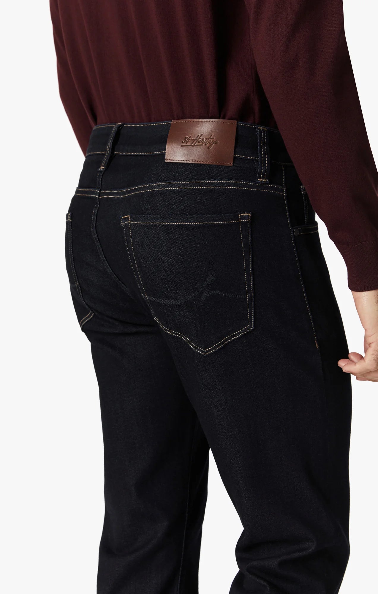 These contemporary pants are designed in a tailored, straight leg silhouette. Detailed with tonal hardware and contrast stitching, this mid-weight staple elevates any ensemble with its superior comfort, soft hand feel, and exceptional stretch.