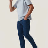 Crafted with a modern mid-rise and an ultra-comfortable straight-leg fit, these jeans offer the perfect balance of contemporary style and timeless appeal. Made from premium, sustainable recycled materials, they’re finished in a sleek night blue wash for an effortlessly refined look ideal for everyday wear.