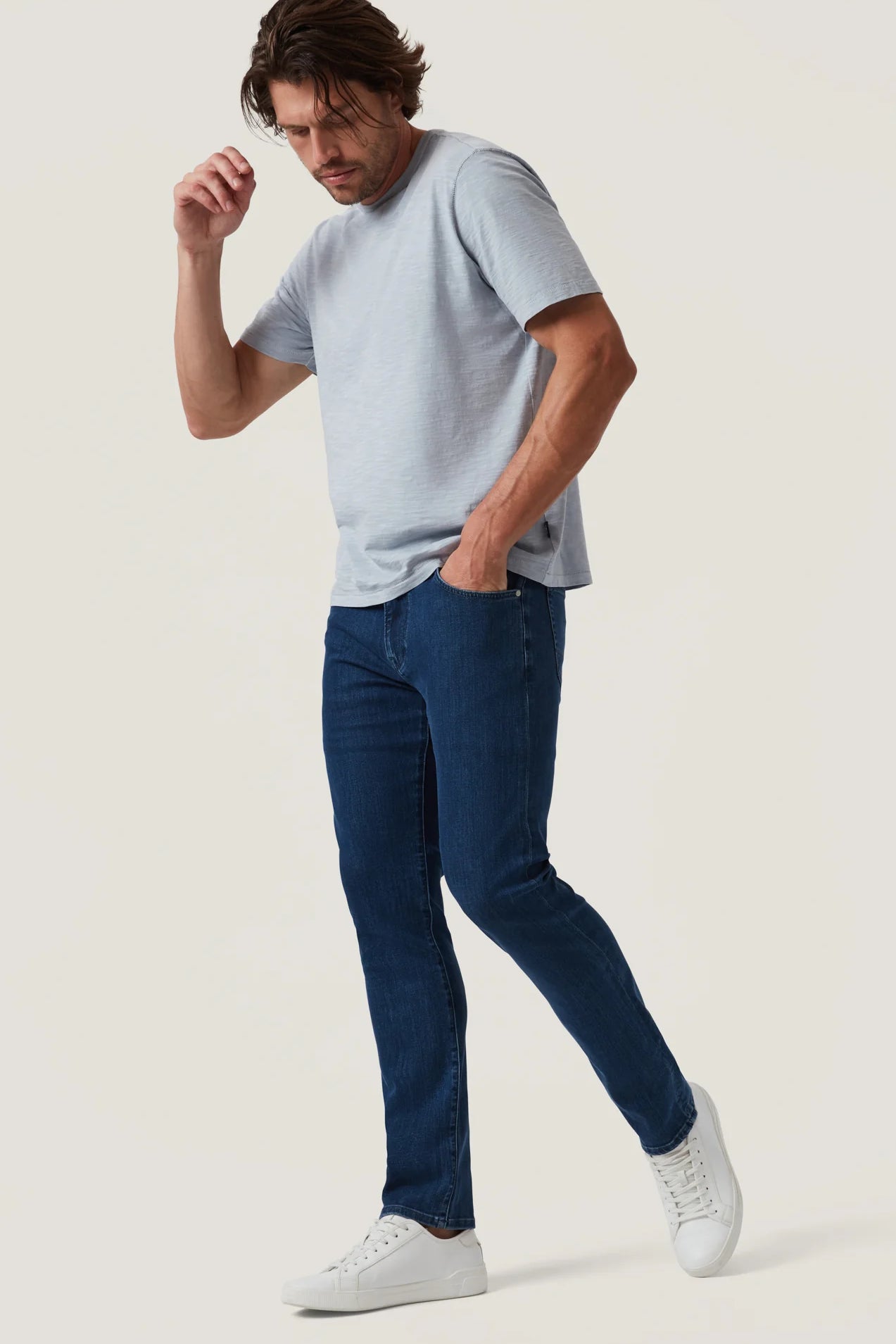 Crafted with a modern mid-rise and an ultra-comfortable straight-leg fit, these jeans offer the perfect balance of contemporary style and timeless appeal. Made from premium, sustainable recycled materials, they’re finished in a sleek night blue wash for an effortlessly refined look ideal for everyday wear.