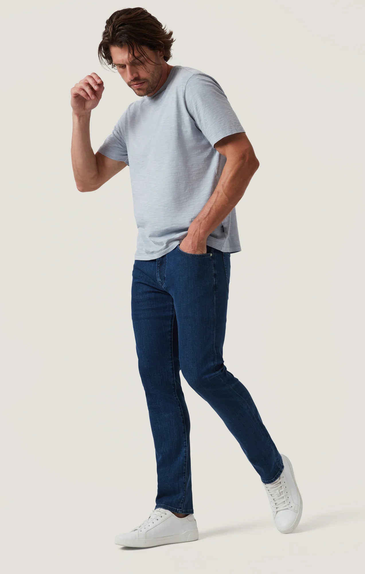Crafted with a modern mid-rise and an ultra-comfortable straight-leg fit, these jeans offer the perfect balance of contemporary style and timeless appeal. Made from premium, sustainable recycled materials, they’re finished in a sleek night blue wash for an effortlessly refined look ideal for everyday wear.