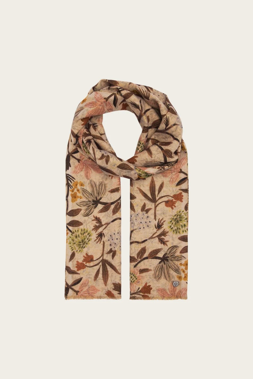 Floral printed scarf  in shades of brown, green and orange photographed on a light backdrop.