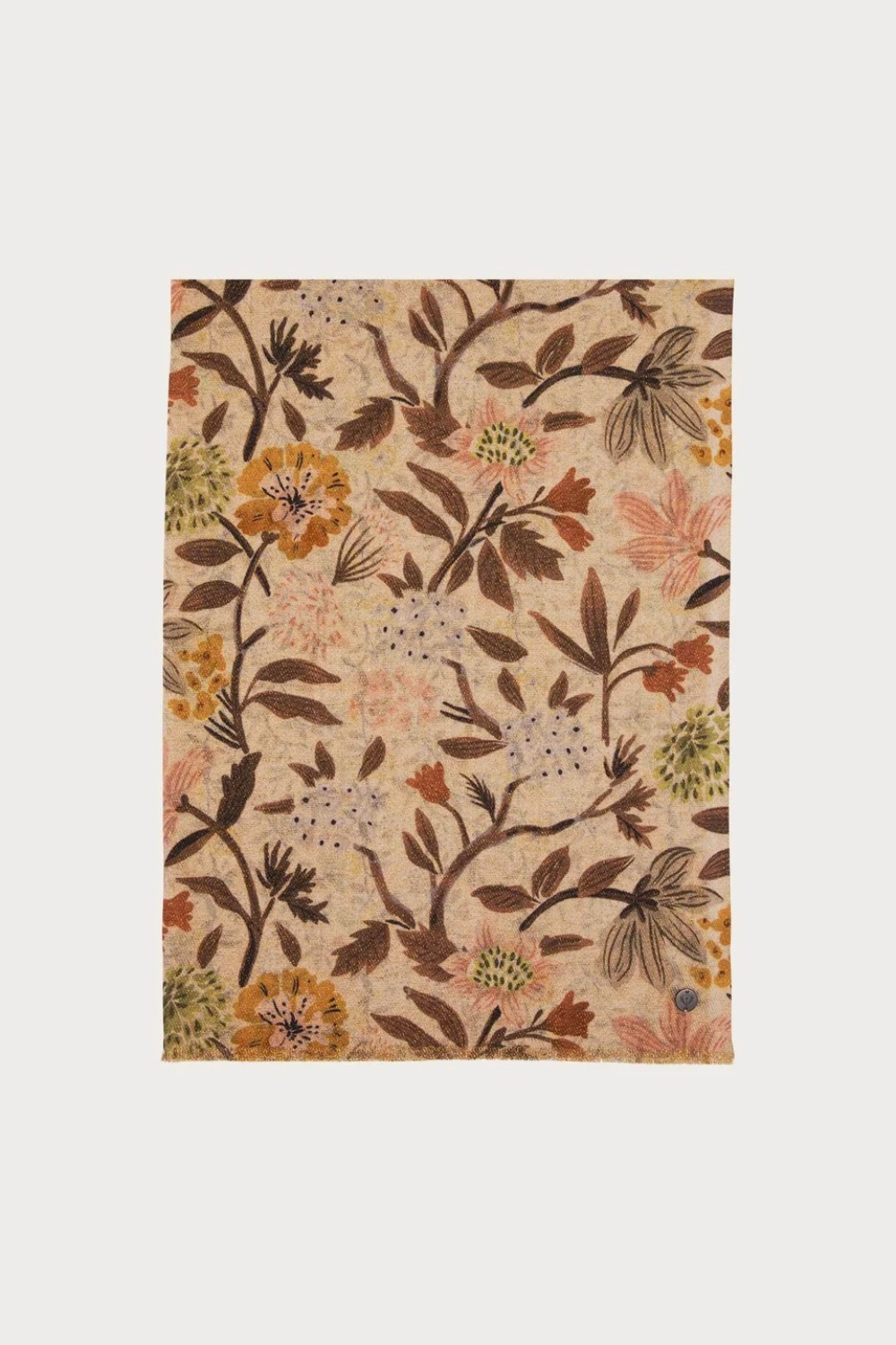 Floral printed scarf  in shades of brown, green and orange photographed on a light backdrop.
