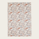 Cream coloured scarf with a brown and grey equestrian print photographed on a light background.