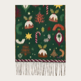 A dark green knit scarf with festive Christmas motifs including candy canes, stars, and trees, finished with fringe at the bottom.