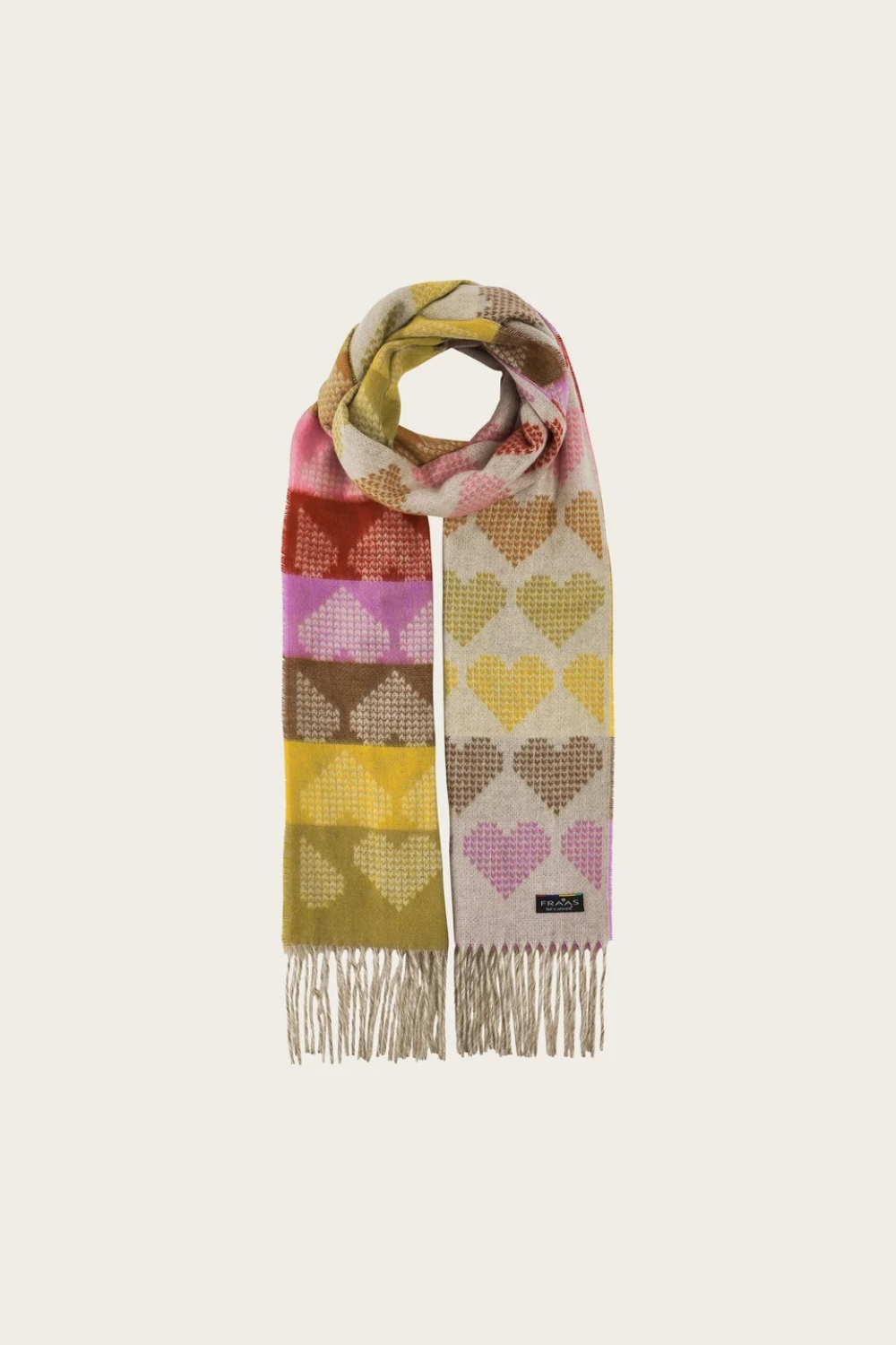 A multi coloured heart printed scarf, with fringe, photographed on a light background.