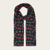 A black base scarf with a cherry print  photographed on a light backdrop.
