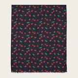 A black base scarf with a cherry print  photographed on a light backdrop.