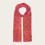 Red paisley scarf photographed on a light background.