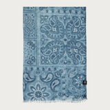 Blue  paisley printed scarf photographed on a light background.