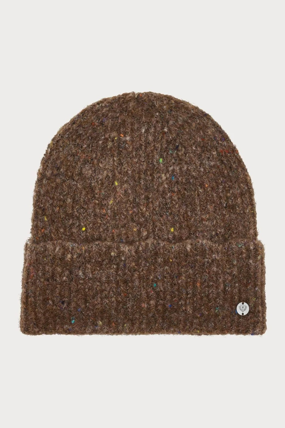 Brown toque with multi coloured speckles photographed on a light background.