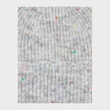 Close up of a grey toque with multi coloured speckles photographed on a light background.