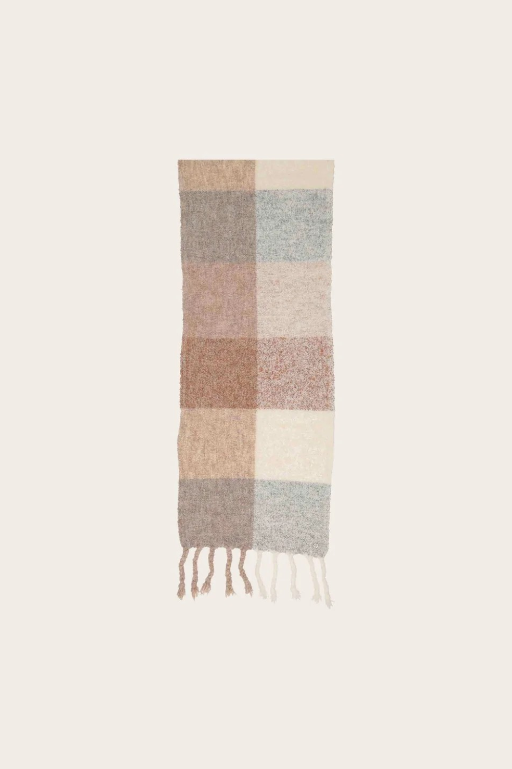 A multi coloured checkered scarf with fringe photographed on a light background.