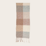 A multi coloured checkered scarf with fringe photographed on a light background.