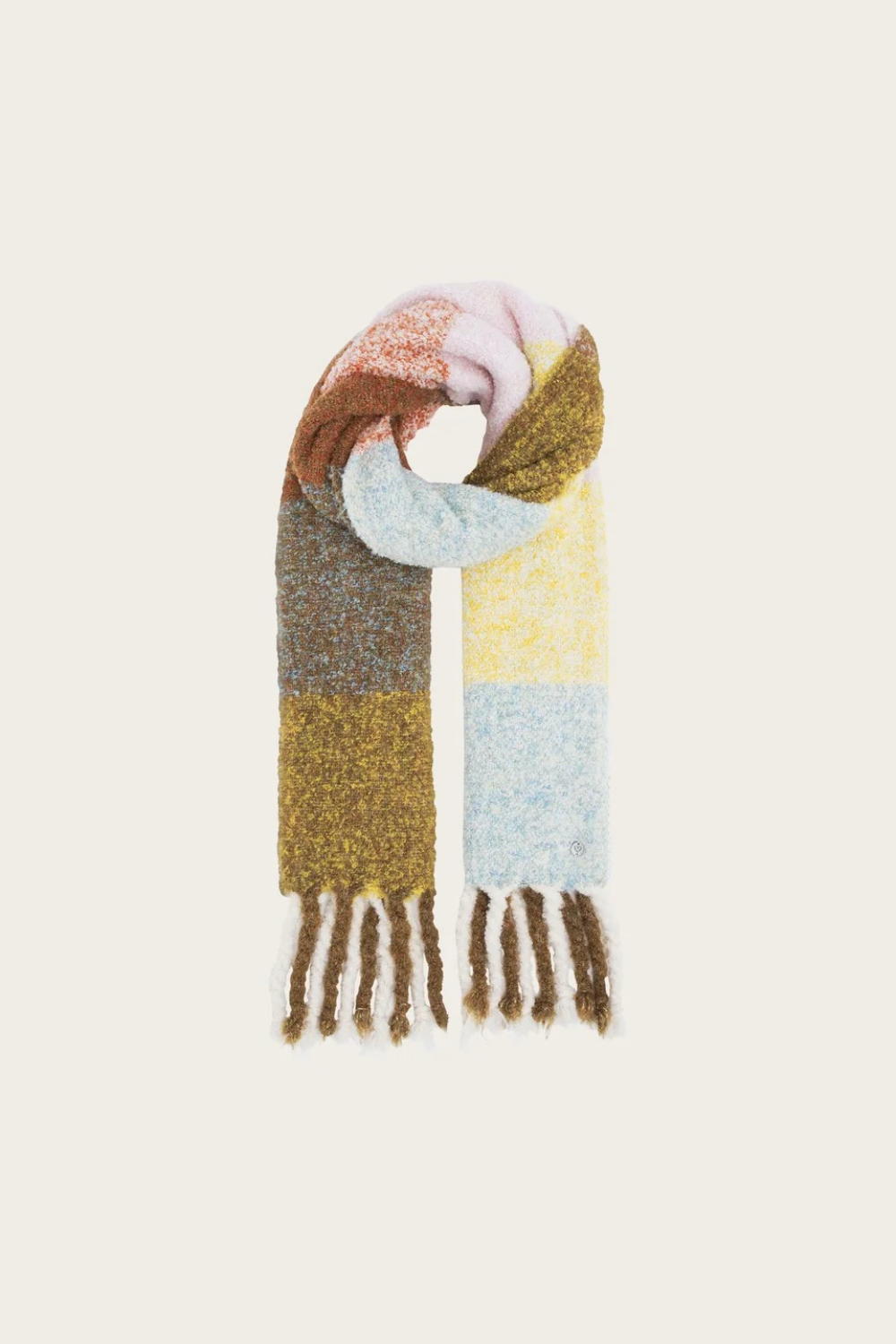 A multi coloured checkered scarf with fringe photographed on a light background.