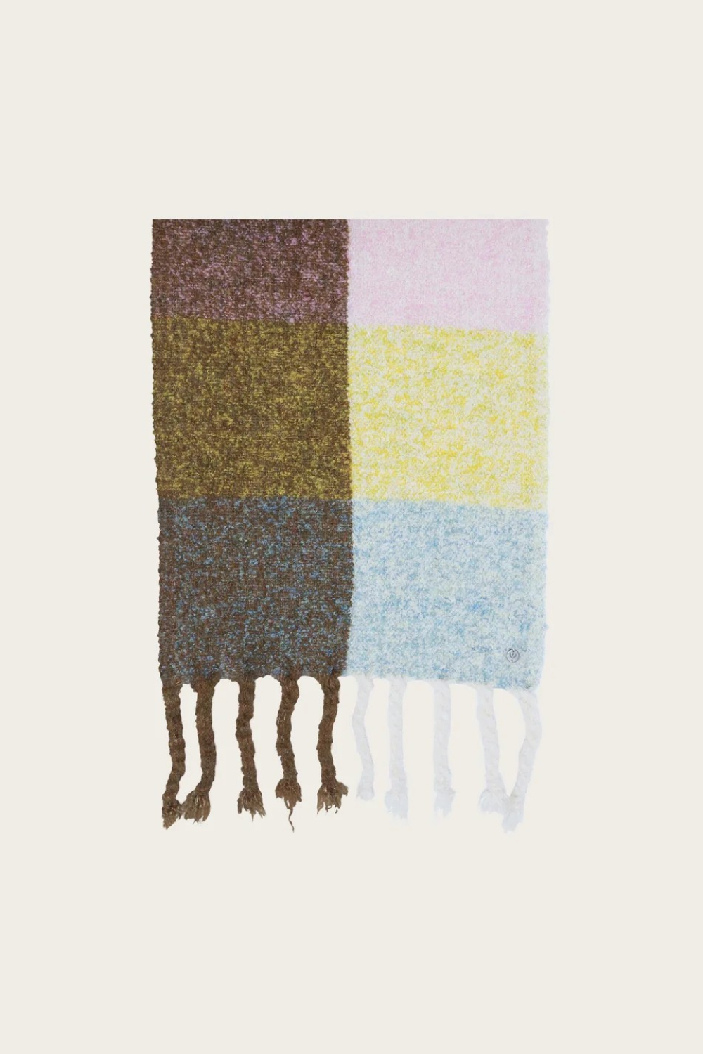 A multi coloured checkered scarf with fringe photographed on a light background.