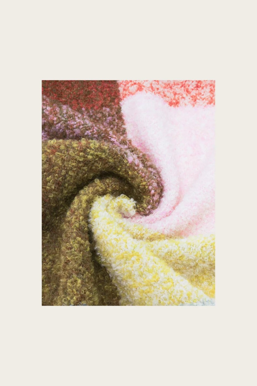 A close up of a multi coloured checkered scarf photographed on a light background.