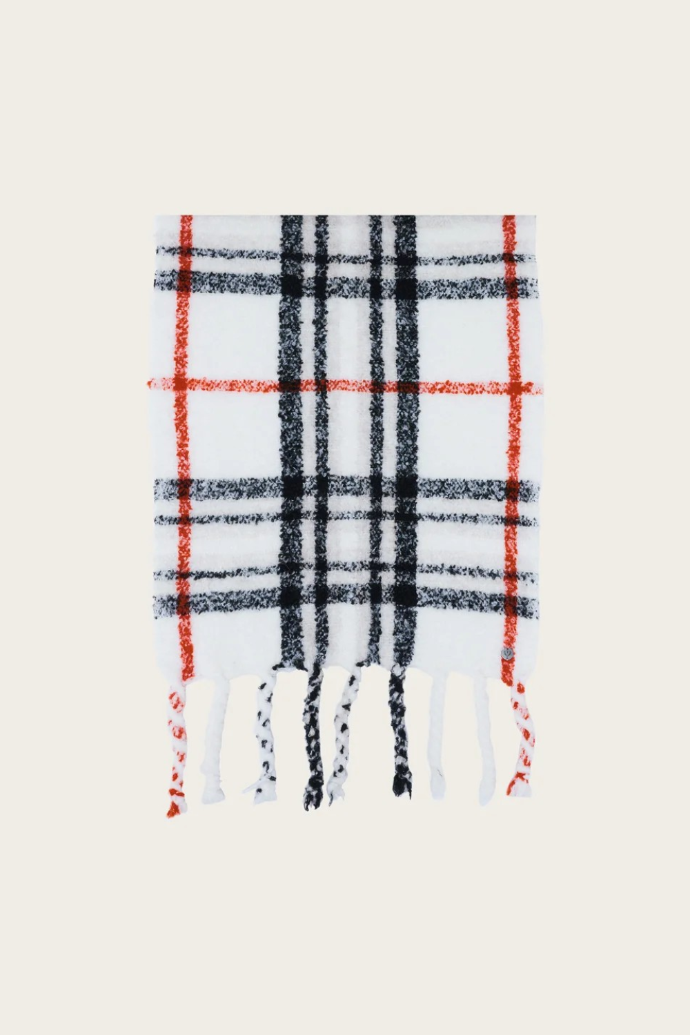 A cream, black and orange plaid scarf with fringe photographed on a light background.
