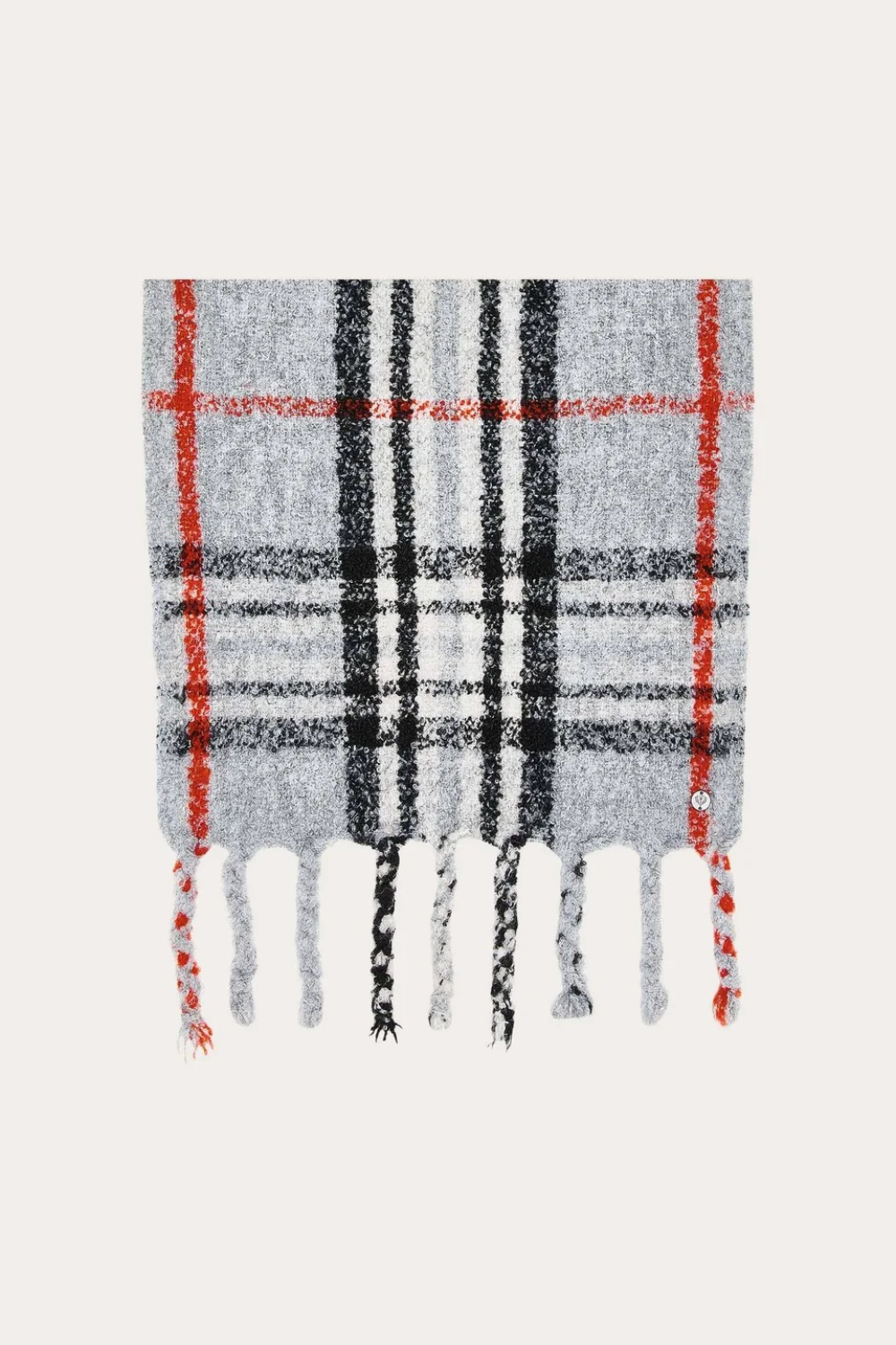 A grey, black and orange plaid scarf with fringe photographed on a light background.