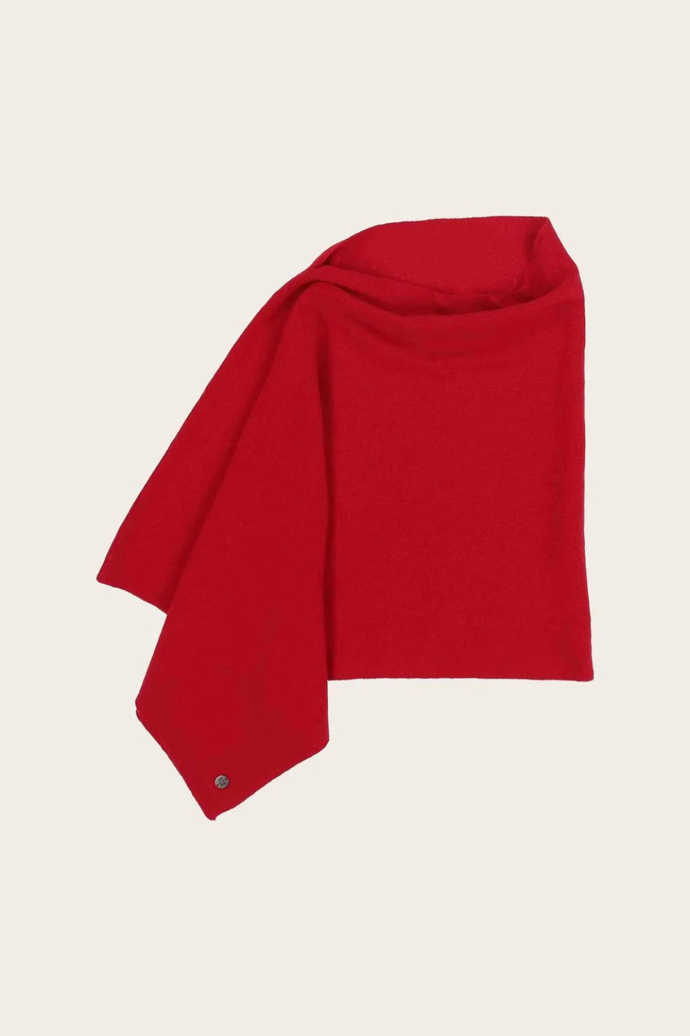 Red poncho photographed against a light background.