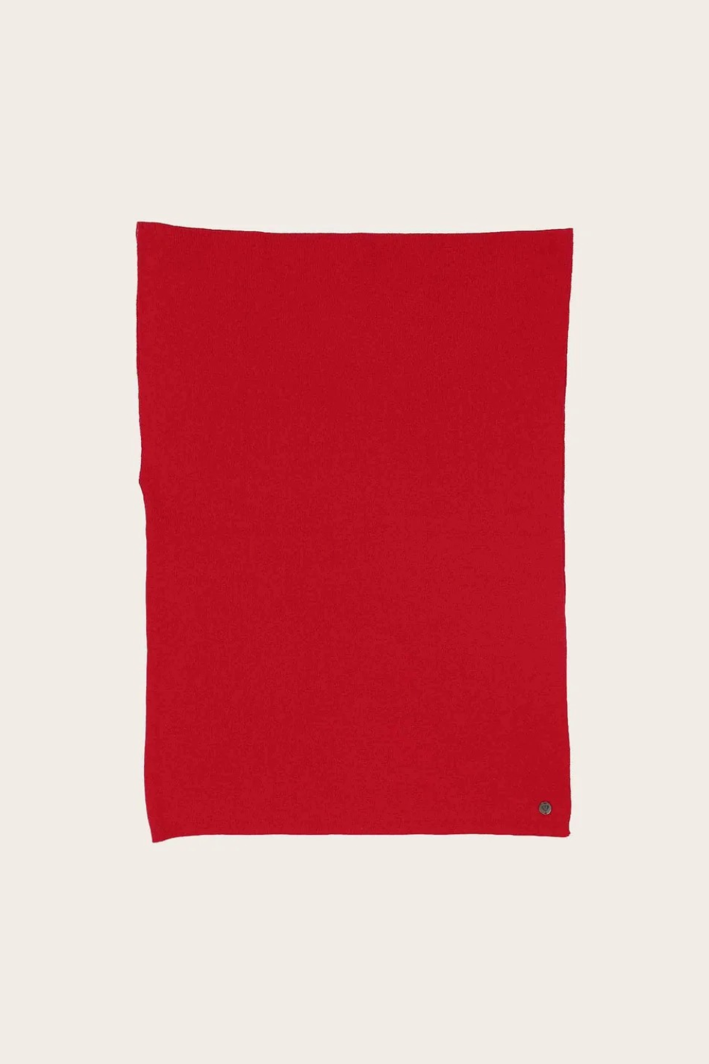 Red fabric photographed against a light background.