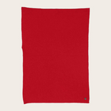 Red fabric photographed against a light background.