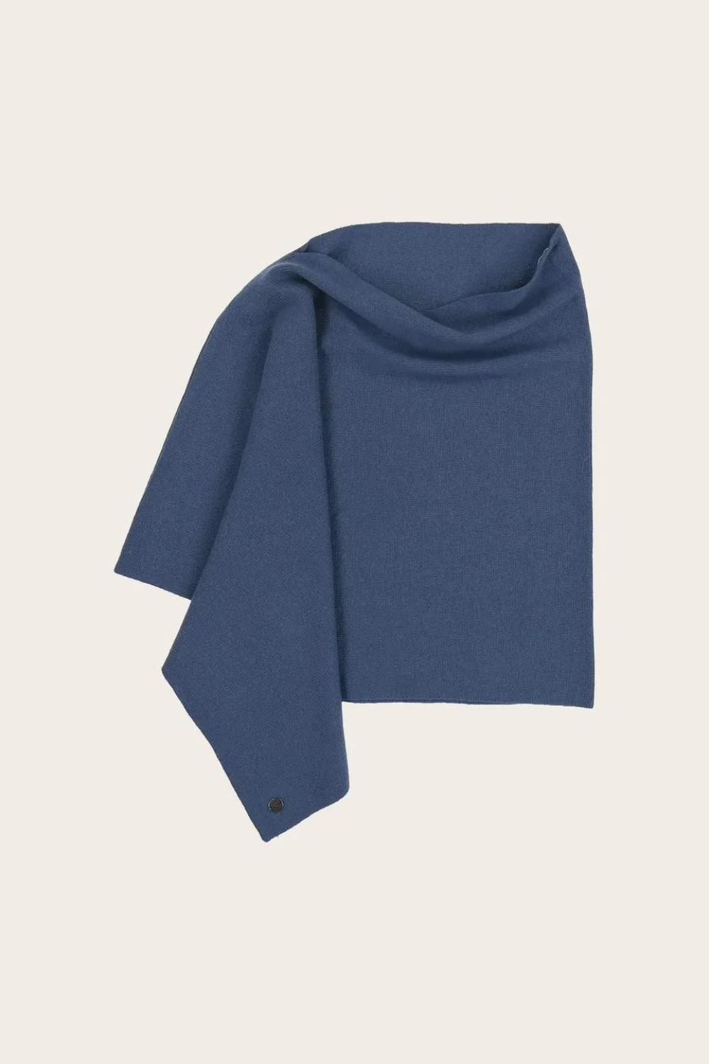 Blue poncho photographed against a light background.