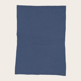 Blue fabric photographed against a light background.