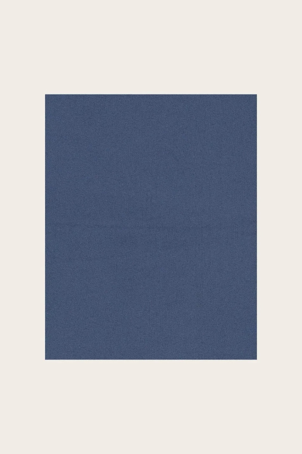 Blue fabric photographed against a light background.
