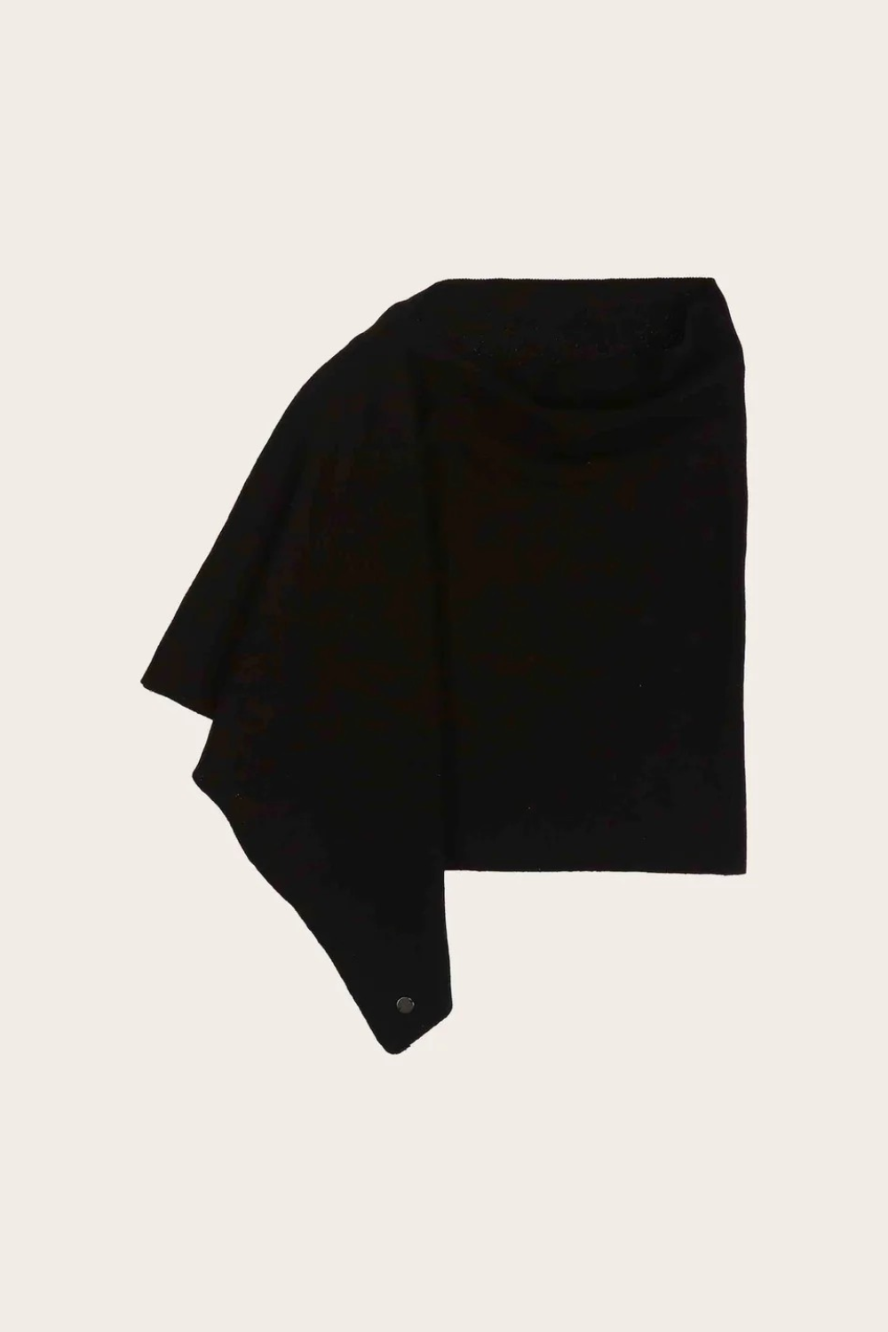 Black poncho photographed on a light background.