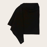 Black poncho photographed on a light background.