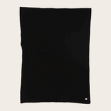 Black fabric photographed on a light background.