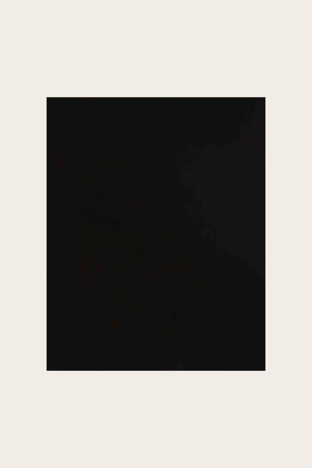 Black fabric photographed on a light background.