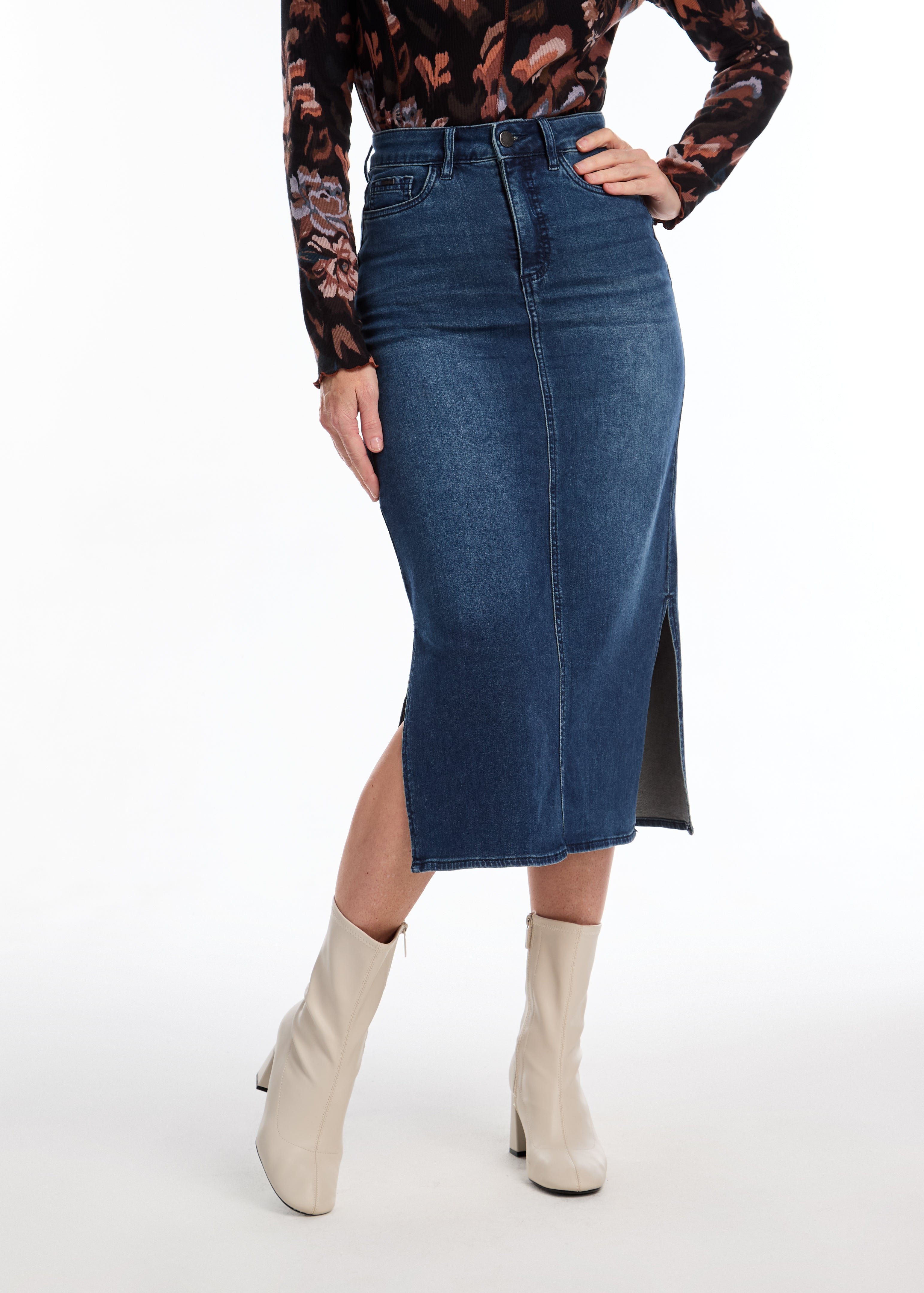 Crafted from soft denim, this FDJ column skirt offers comfort and versatility. With side slits for added mobility and style, this skirt is perfect for everyday wear or dressing up for a night out. Experience the luxurious feel of this skirt while looking effortlessly chic.