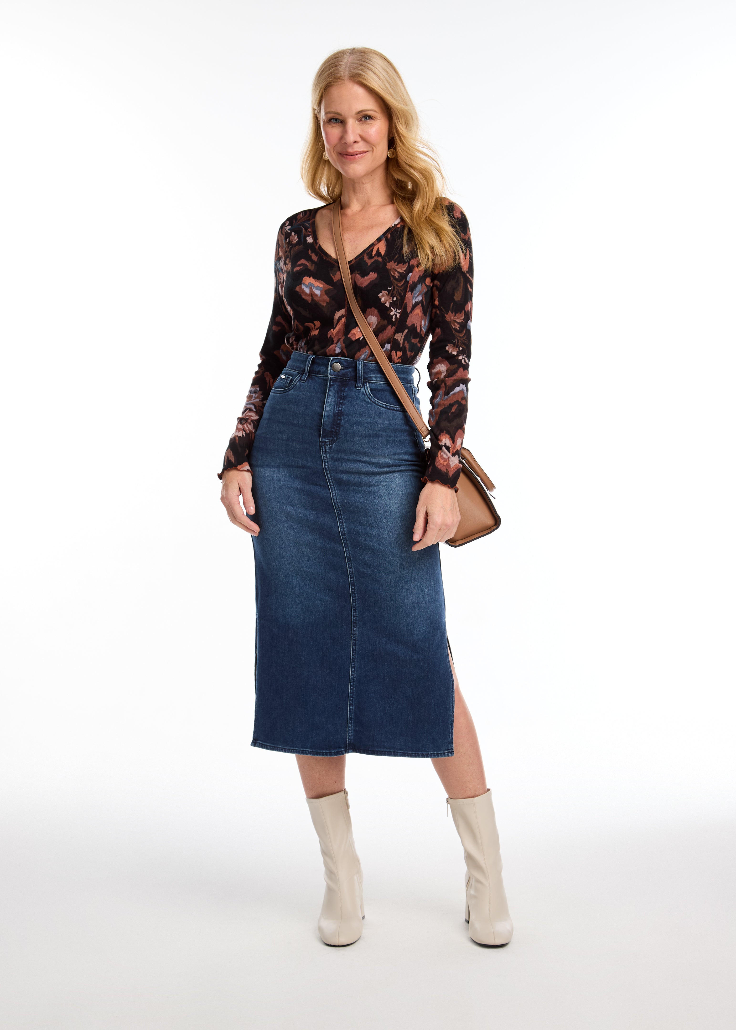 Crafted from soft denim, this FDJ column skirt offers comfort and versatility. With side slits for added mobility and style, this skirt is perfect for everyday wear or dressing up for a night out. Experience the luxurious feel of this skirt while looking effortlessly chic.