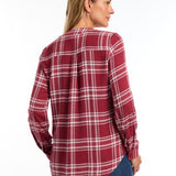 The FDJ Check Textured Tunic boasts a comfortable popover design with a stylish v-neck. The roll tab on the sleeve adds a touch of versatility, while the plaid pattern adds a classic look. Perfect for any casual occasion, this tunic is both functional and fashionable.