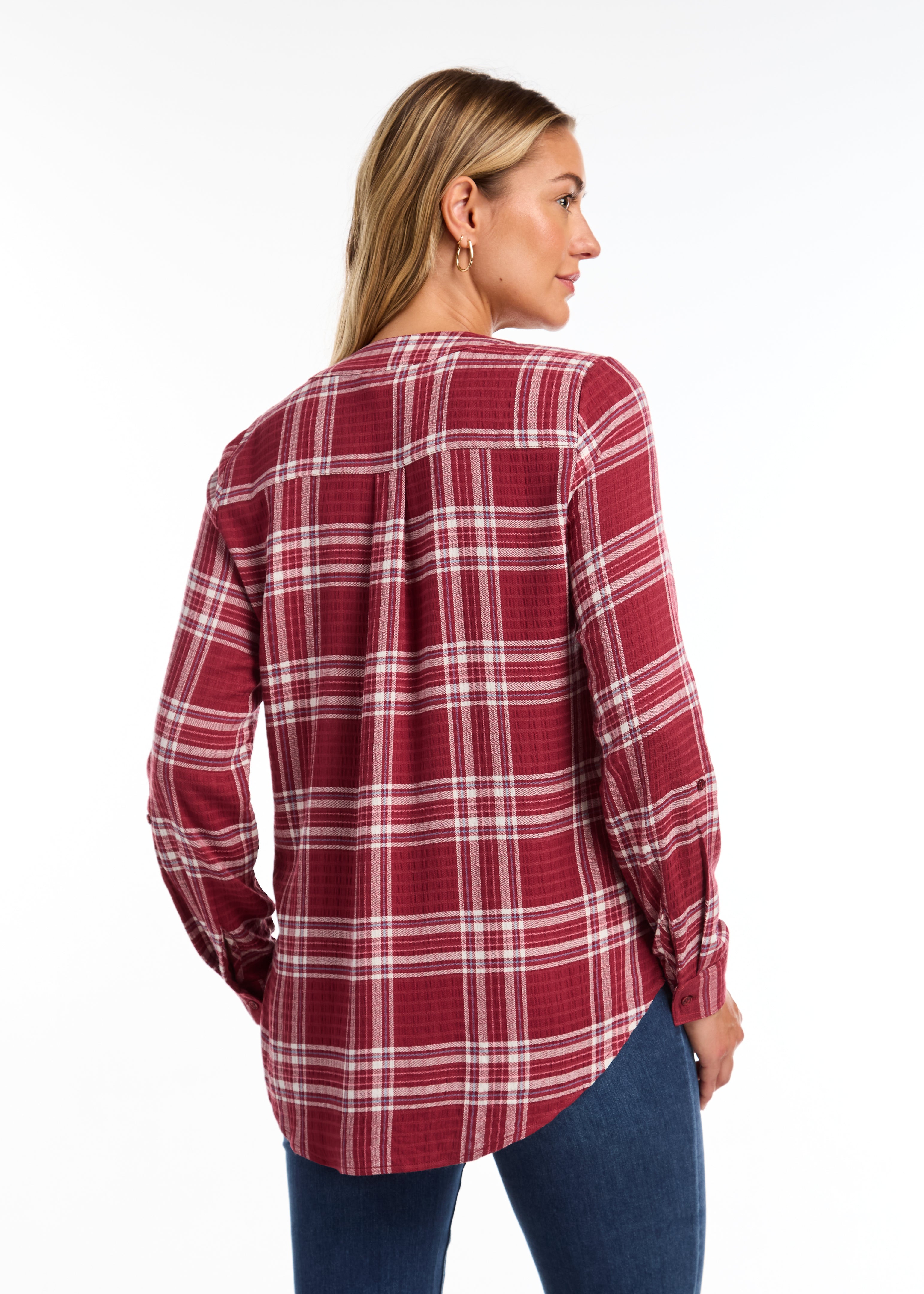 The FDJ Check Textured Tunic boasts a comfortable popover design with a stylish v-neck. The roll tab on the sleeve adds a touch of versatility, while the plaid pattern adds a classic look. Perfect for any casual occasion, this tunic is both functional and fashionable.