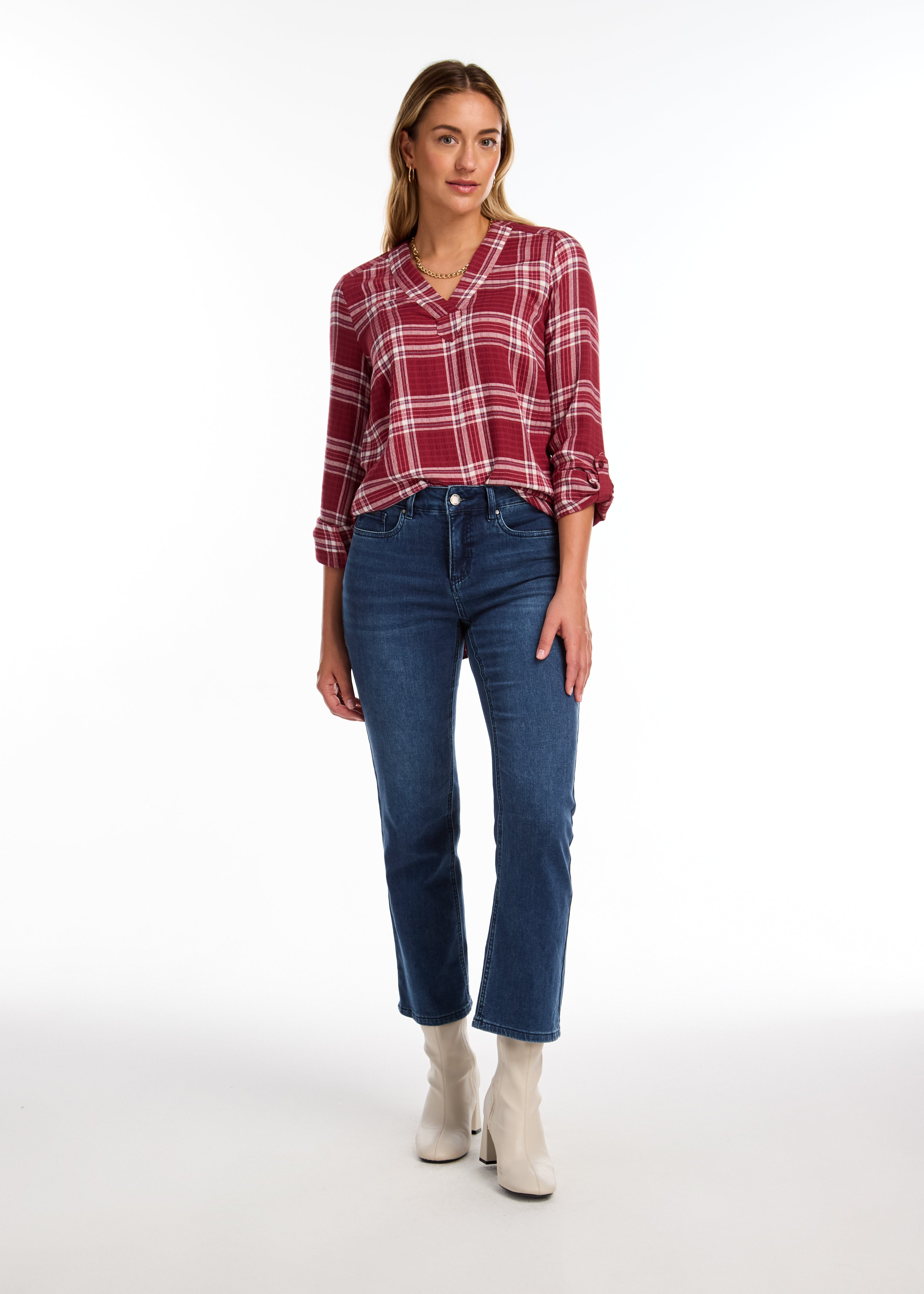 The FDJ Check Textured Tunic boasts a comfortable popover design with a stylish v-neck. The roll tab on the sleeve adds a touch of versatility, while the plaid pattern adds a classic look. Perfect for any casual occasion, this tunic is both functional and fashionable.