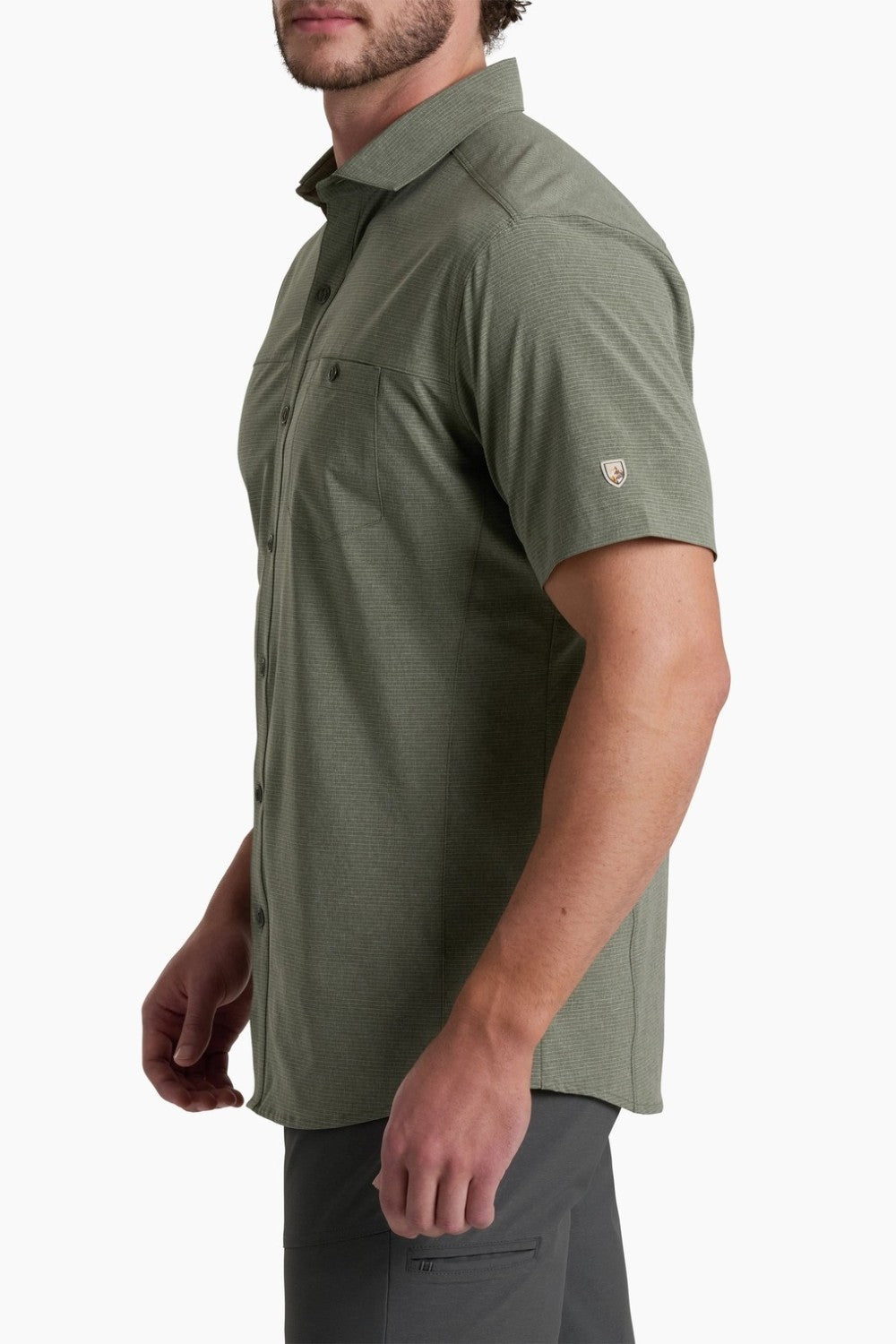 Man wearing a green short-sleeve shirt on a white background