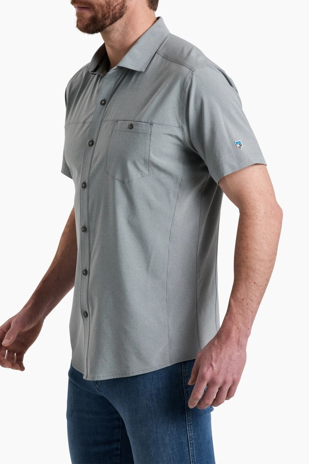 Man wearing a gray short-sleeve shirt with a collar on a white background