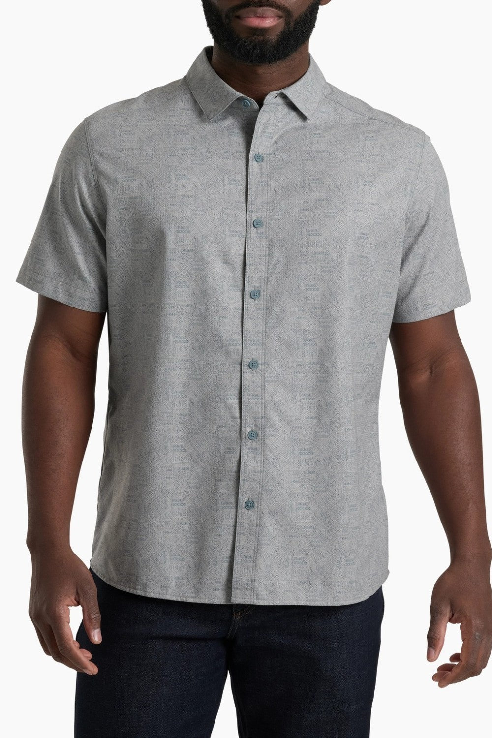 Man wearing a gray short-sleeve button-up shirt on a white background