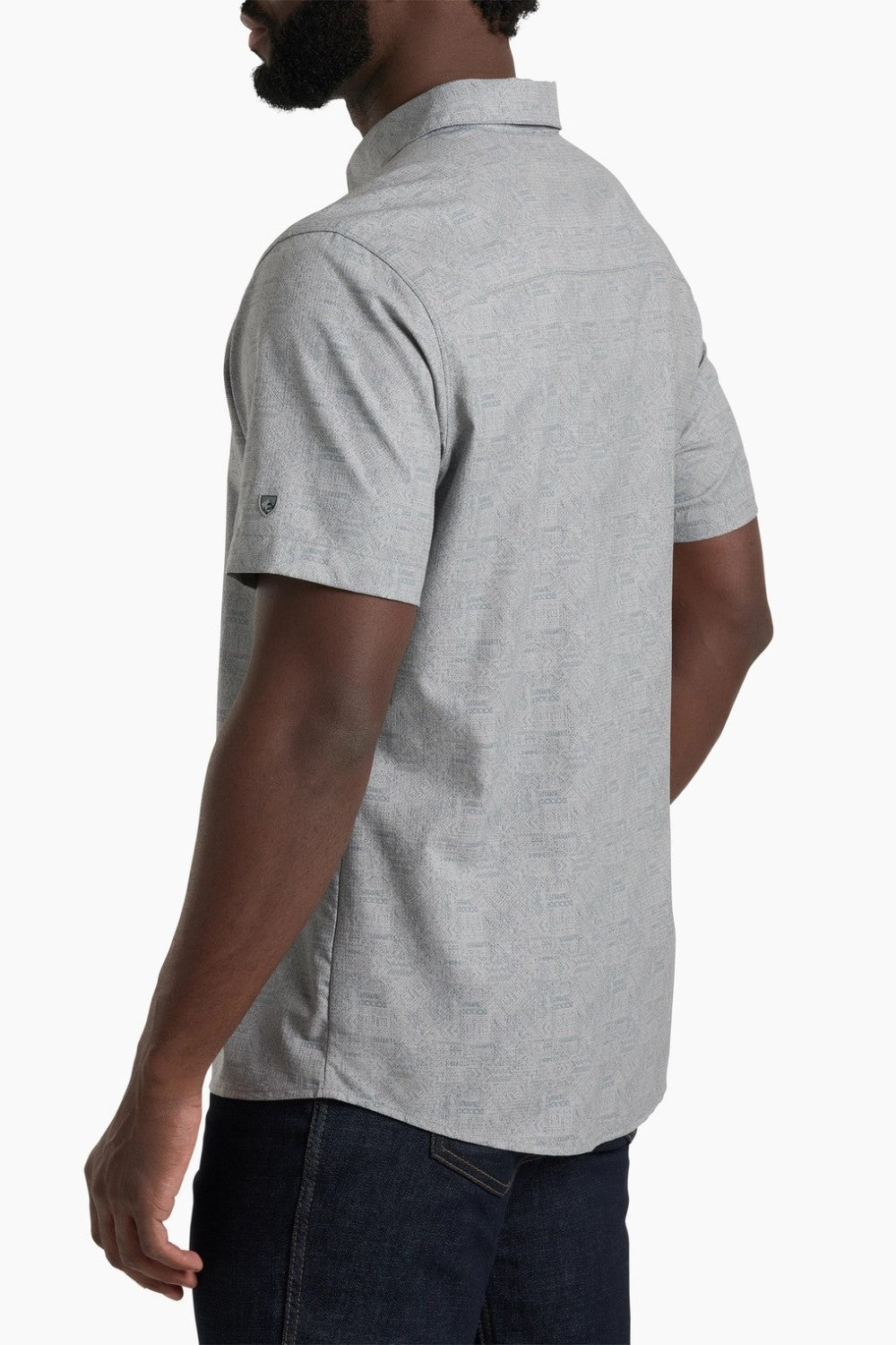 Person wearing a gray short-sleeve shirt on a white background