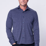 Man wearing a blue button-up shirt against a white background